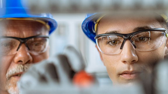 Two people in a data centre.